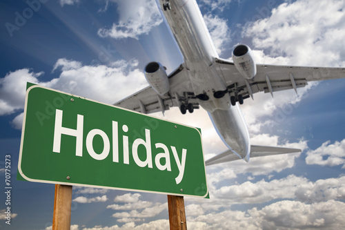Holiday Green Road Sign and Airplane Above