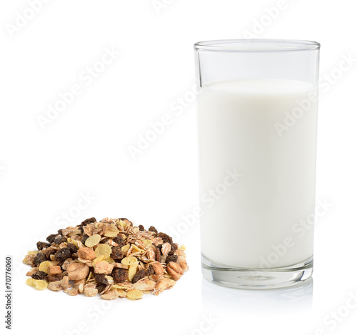 pile of muesli and fresh milk in the glass isolated on white bac