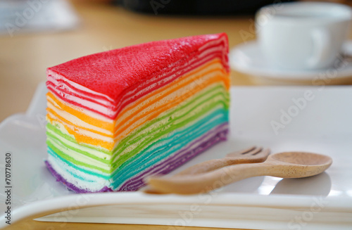 Rainbow crape cake on white plate. (Selective Focus)
