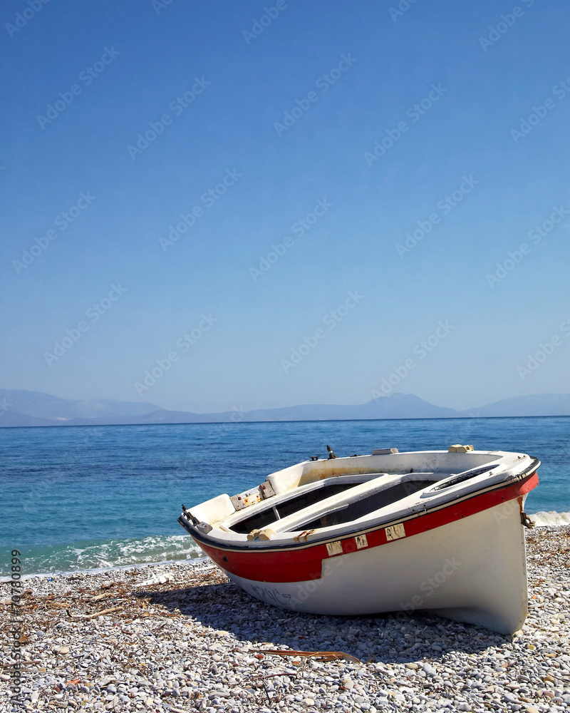 Corinthian gulf Greece, small boat on the beach Corinthian gulf Greece, small boat on the beach