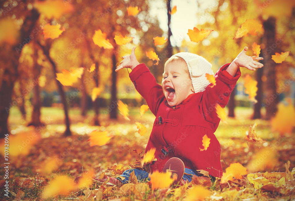 happy little child, baby girl laughing and playing in autumn - obrazy, fototapety, plakaty 