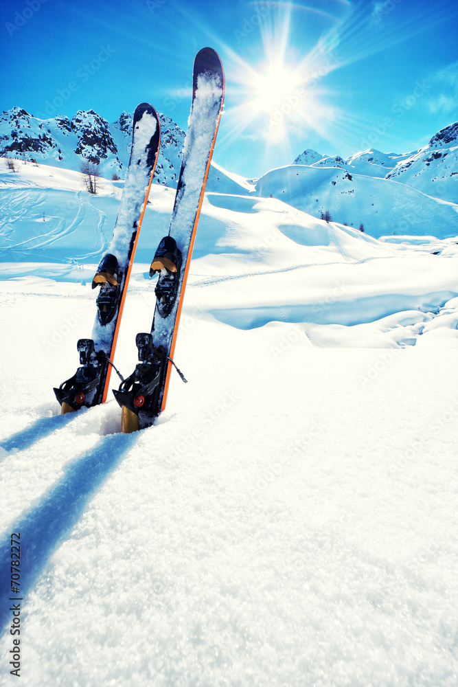 Skis in snow at Mountains - obrazy, fototapety, plakaty 
