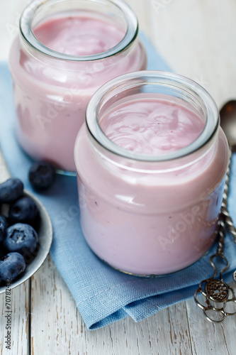fresh yogurt with blueberries in glass jars