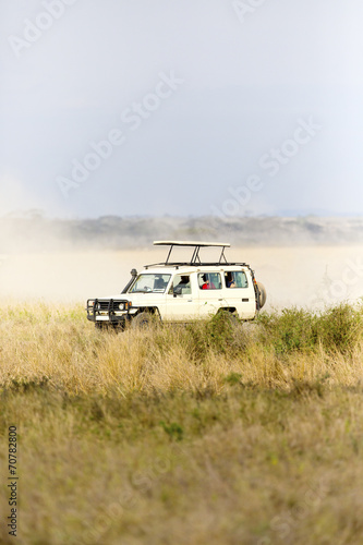 Safari tourists on game drive in Serengeti © kjekol