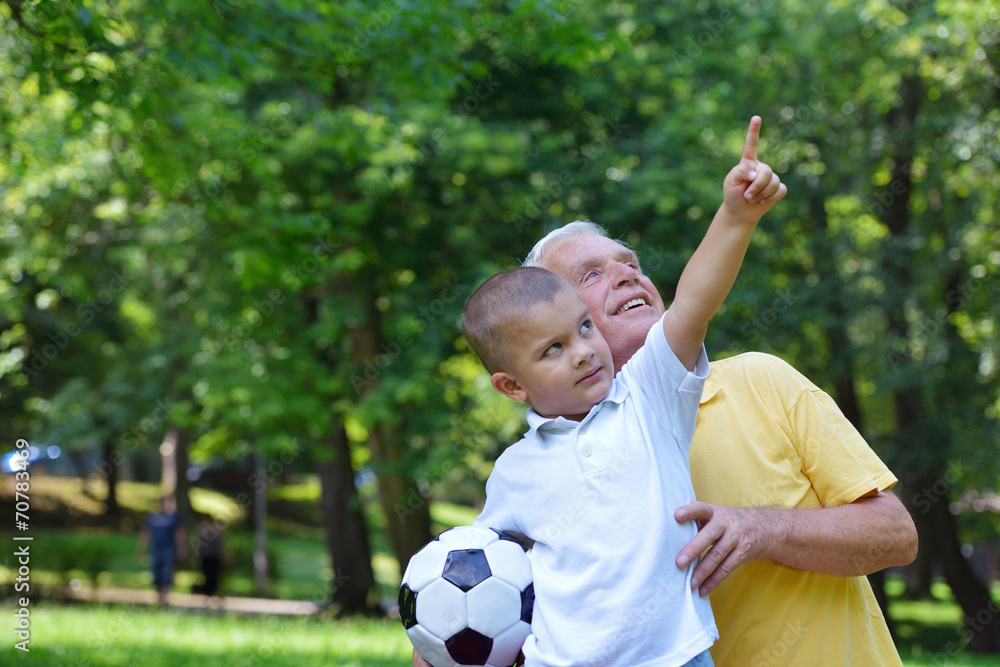 happy grandfather and child in park happy grandfather and child in park