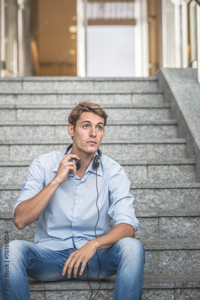 young model hansome blonde man with headphones young model hansome blonde man with headphones