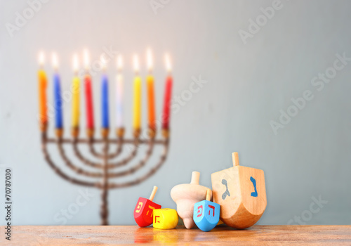 image of front woodwn table and menorah un the background. hanuk photo