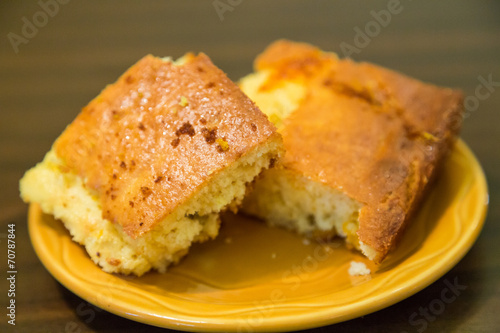 Two Pieces of Cornbread on Plate