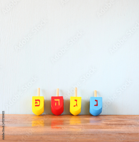 Wooden dreidels for hanukkah on wooden table