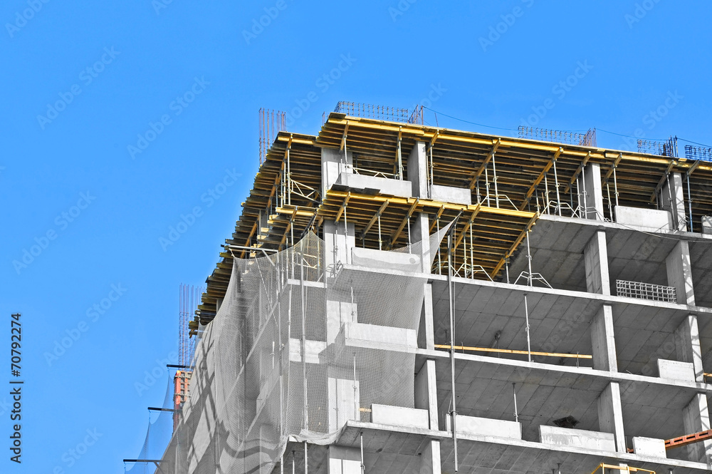 Building construction site work against blue sky Building construction site work against blue sky