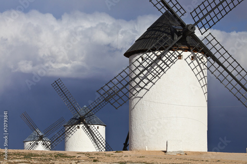 Windmills and dark, cloudy sky, Campo de Criptana, Spain