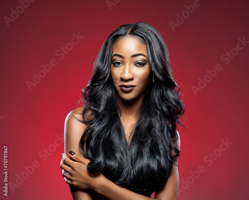 Black woman with long luxurious shiny hair photo