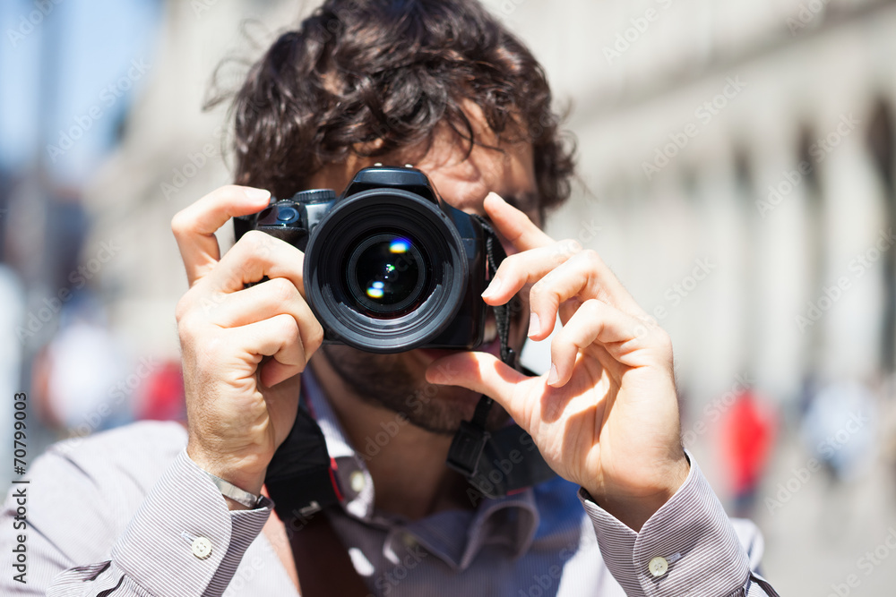 Photographer using his camera