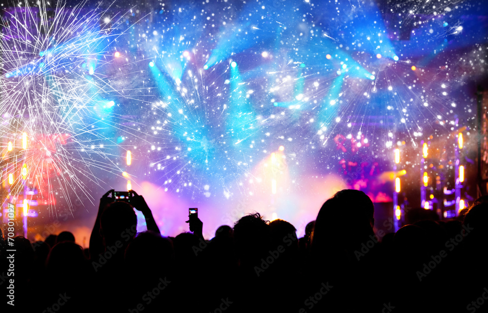 Crowd celebrating the New year with fireworks Crowd celebrating the New year with fireworks