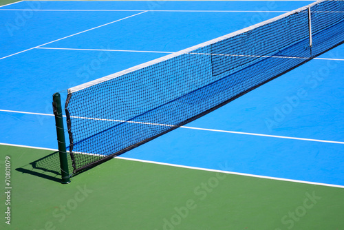 blue and green tennis court © sutichak