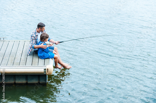 Father and son fishing.