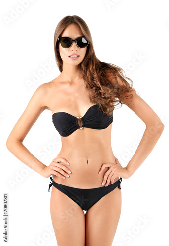 Beautiful young woman in black swimsuit isolated on white © Africa Studio