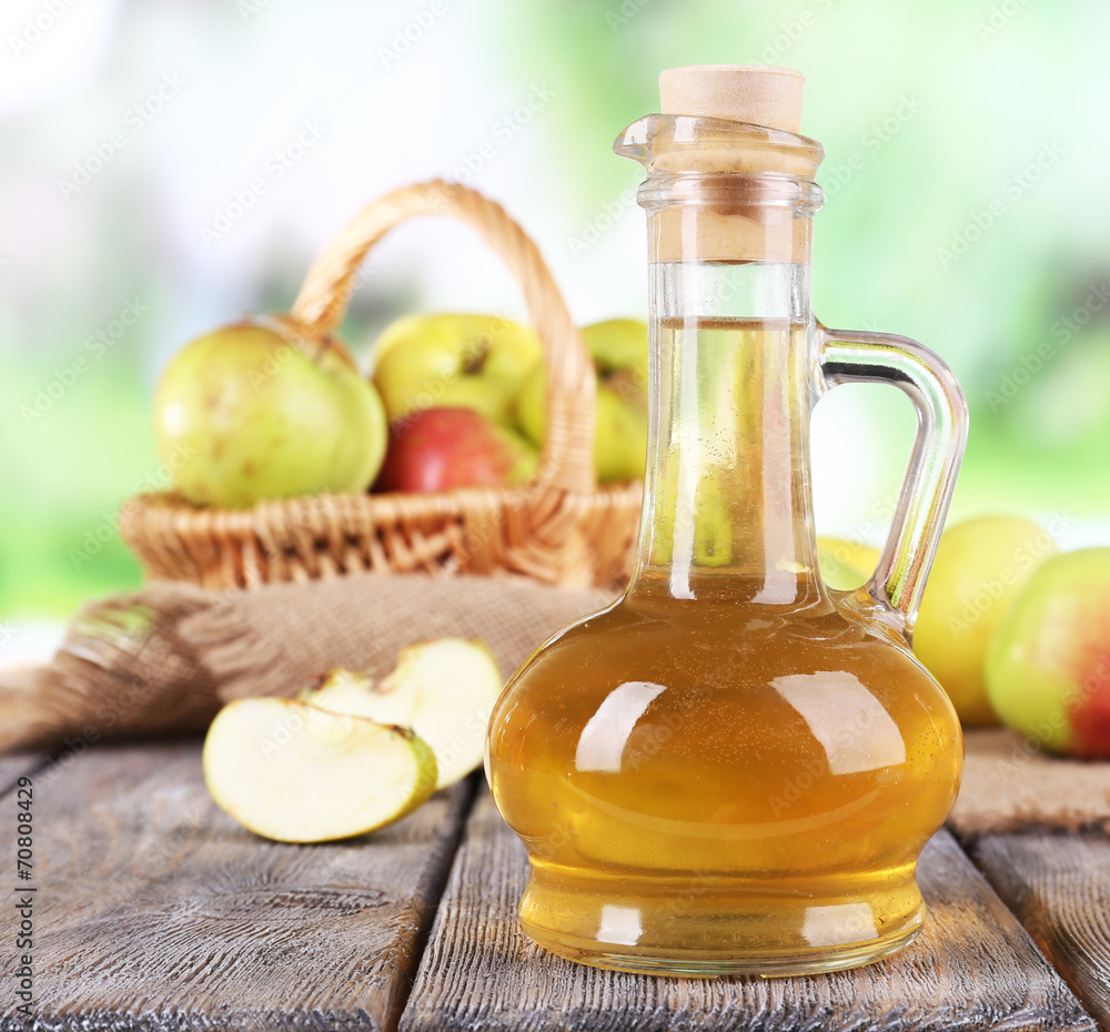 Apple cider vinegar in glass bottle and ripe fresh apples, Apple cider vinegar in glass bottle and ripe fresh apples,