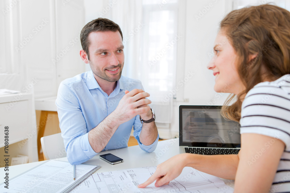 Real estate agent and customer at the office Real estate agent and customer at the office