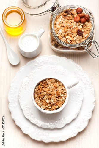 Granola with milk and honey. Healthy breakfast. © Rozmarina