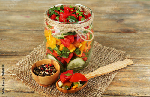 Fototapeta Naklejka Na Ścianę i Meble -  Vegetable salad in glass jar,