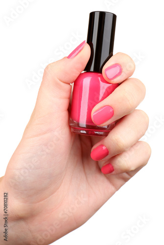 Nail polish in hand, close-up