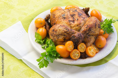 Roast chicken with Sweet kumquat citrus fruits and parsley