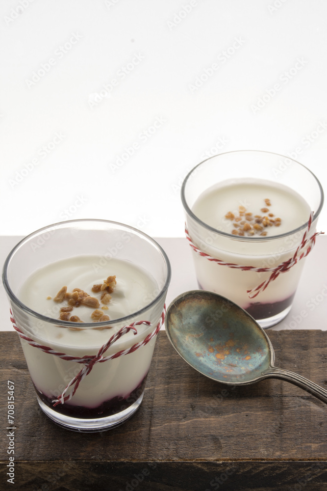 Layered dessert with fruits yogurt and cream cheese in glass jar Layered dessert with fruits yogurt and cream cheese in glass jar