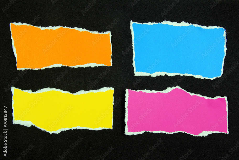 colorful torn paper on black paper background