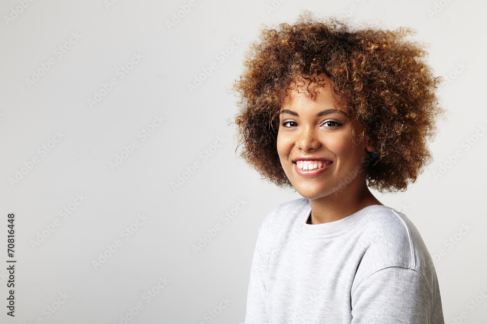 portrait of a latin woman with a curly hair, wearing sweatshirt portrait of a latin woman with a curly hair, wearing sweatshirt