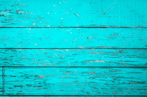 Old wooden painted background in turquoise color.