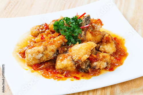 Deep fried grouper fish spicy sweet and sour sauce