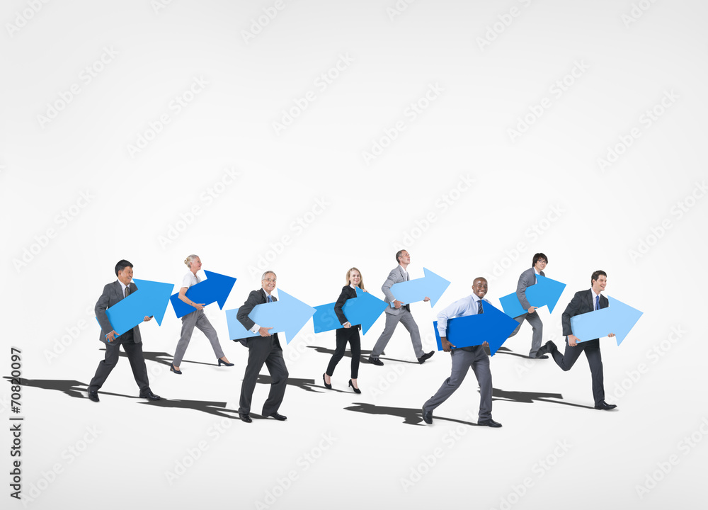 Business People Holding Arrow Sign Business People Holding Arrow Sign