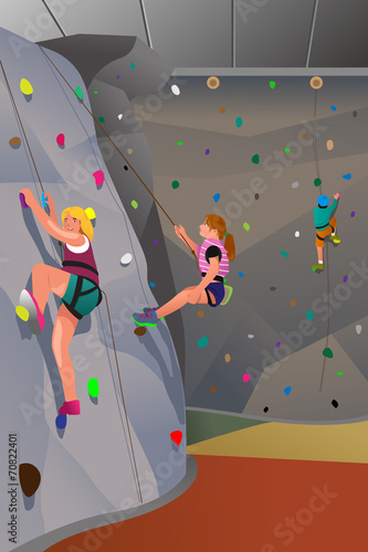 People climbing indoor wall