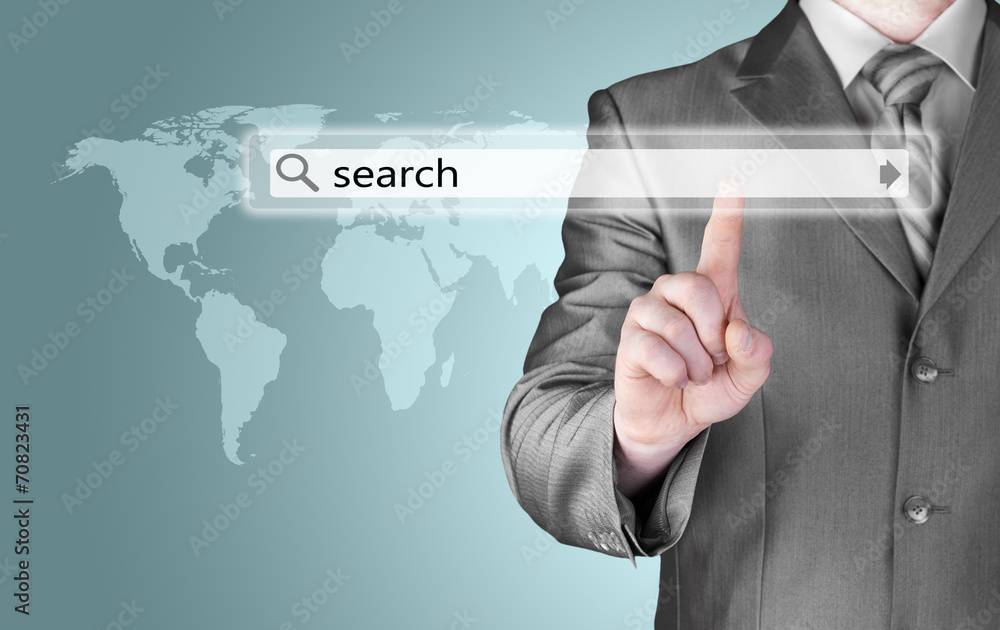Businessman pushing virtual search bar Businessman pushing virtual search bar