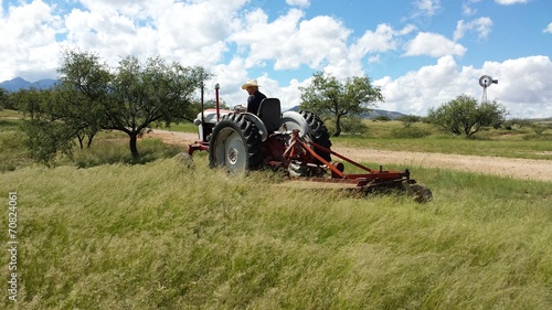 Mowing in the Arizona grasslands with tractor and brushhog