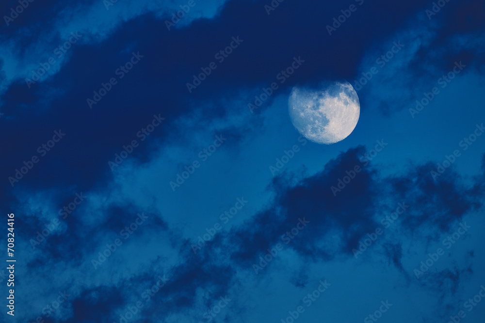 Fototapeta premium Moon in the blue summer sky