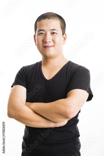 Young asian man standing isolated on white © Originoo Stock