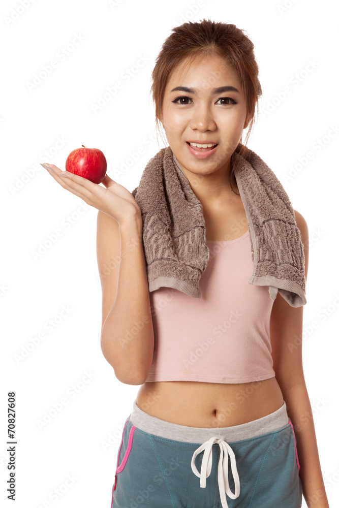 Asian healthy workout girl show red apple on her palm hand Asian healthy workout girl show red apple on her palm hand