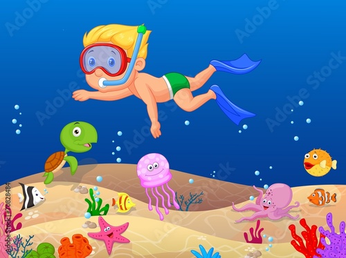 Little boy diving in the ocean