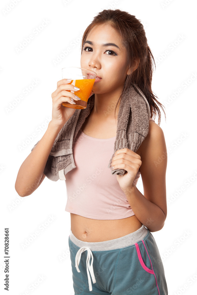 Asian healthy workout girl drinking orange juice Asian healthy workout girl drinking orange juice