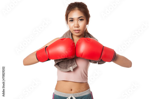 Asian slim girl with red boxing glove