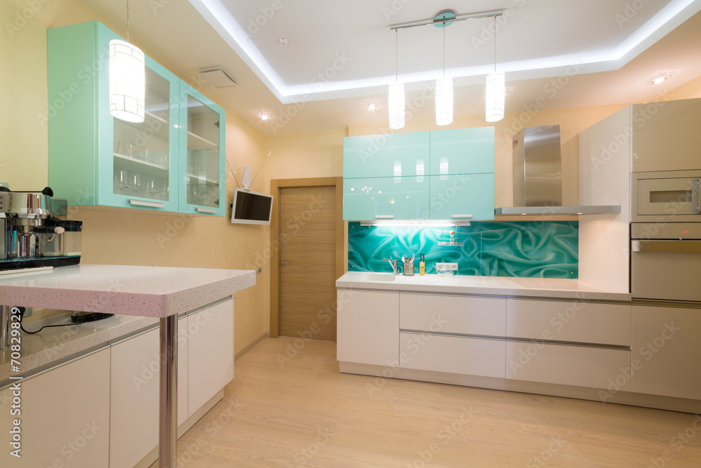 Beautiful modern kitchen with TV and coffee machine. Beautiful modern kitchen with TV and coffee machine.