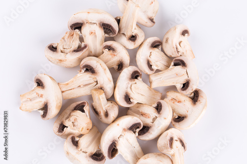 Heap of sliced champignon mushrooms.