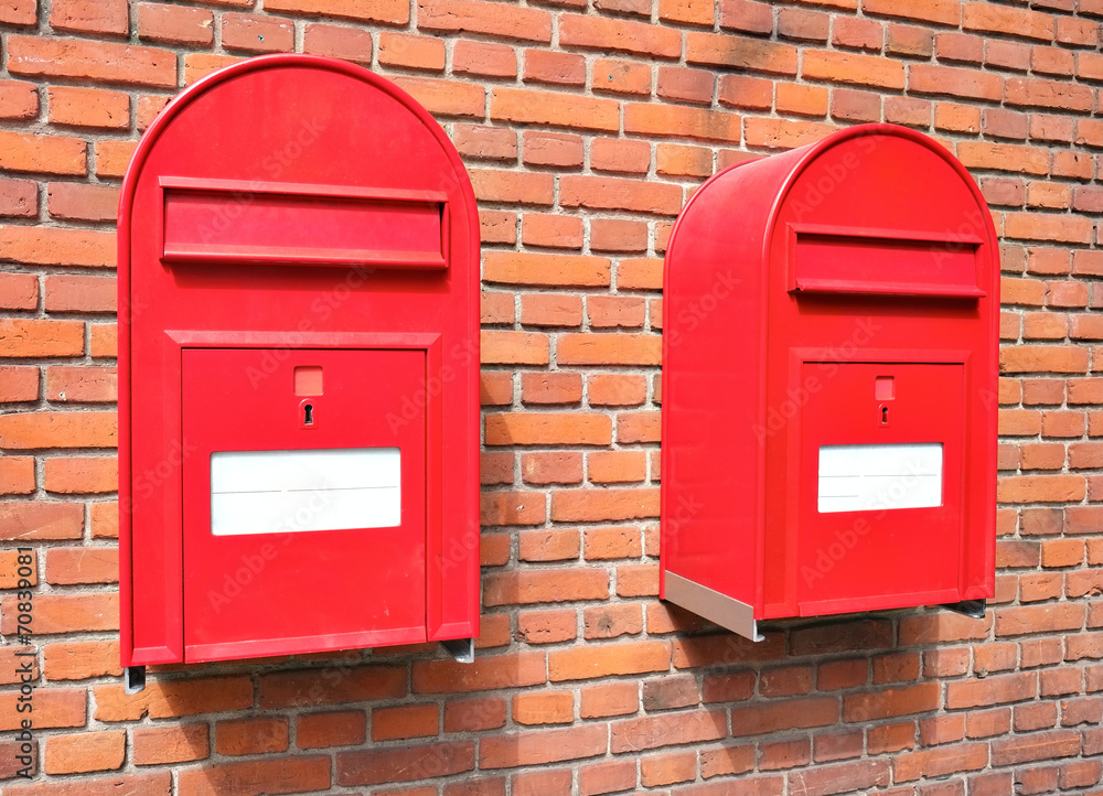 Red mail boxes on brick wall Red mail boxes on brick wall