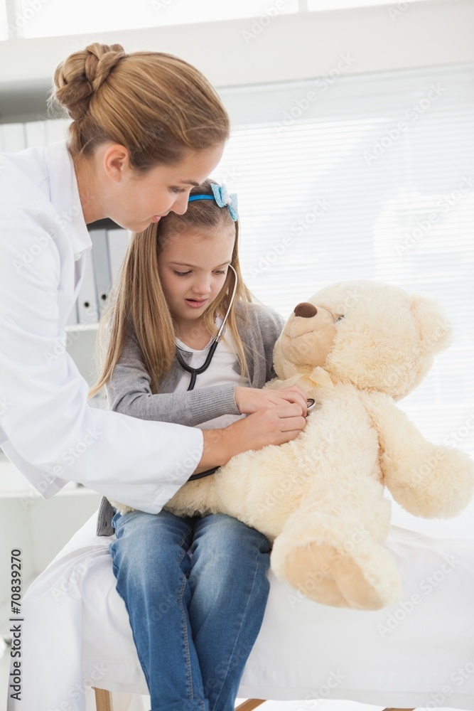 Doctor giving a patient a stuffed bear Doctor giving a patient a stuffed bear