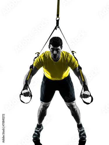 man exercising suspension training trx silhouette