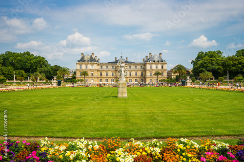 Luxembourg gardens and palace with puffy clouds in Paris