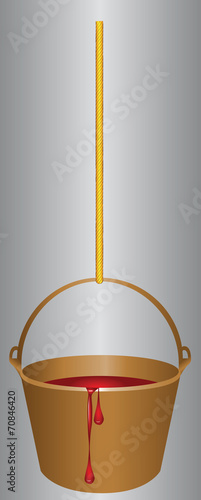 Bucket on a rope with red paint