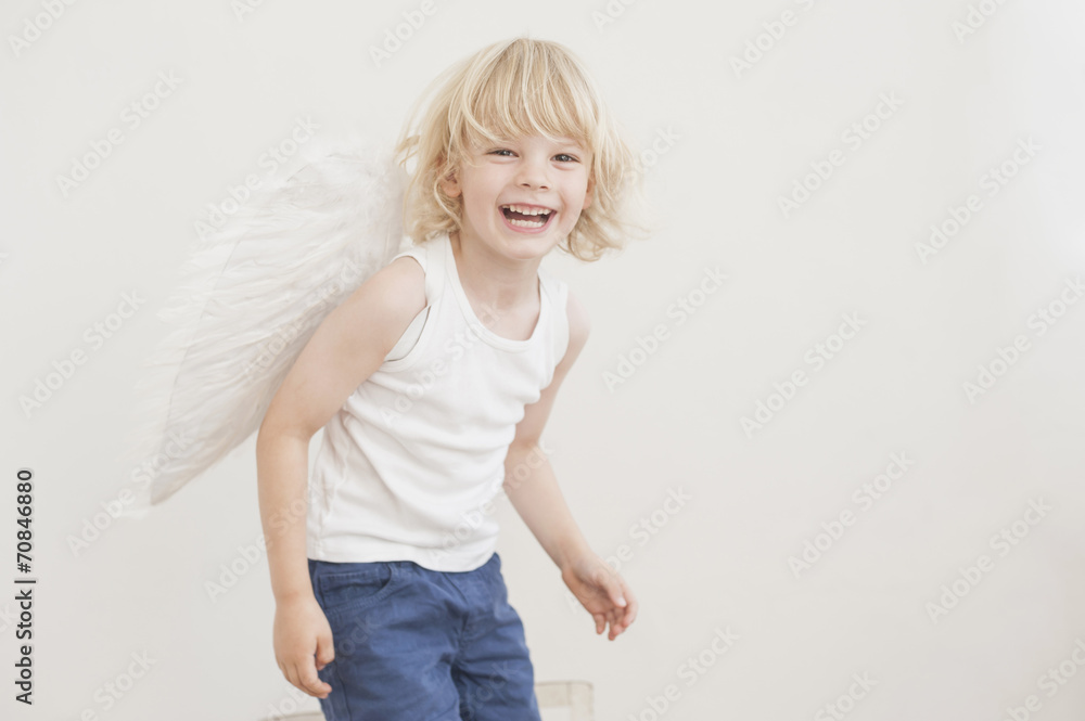 Portrait of laughing little boy with angle wings Portrait of laughing little boy with angle wings